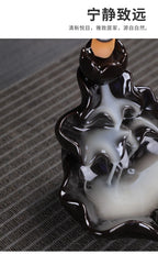 Tower backflow incense burner with black glossy base and central cone