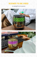 Seven-Light Electric Bakhoor Burner, gold body with green hex light, shown in indoor scene