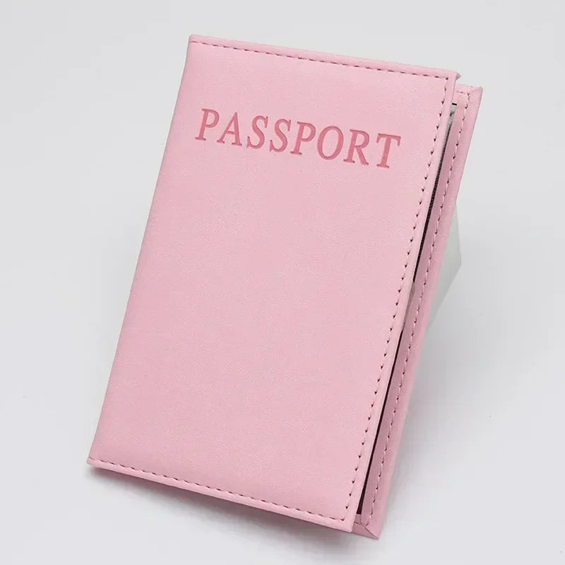 Dusty rose classic travel passport sleeve with “PASSPORT” text and stitching