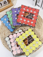Color assortment tea lights in a box: blue, purple, red, green, yellow, pink, white