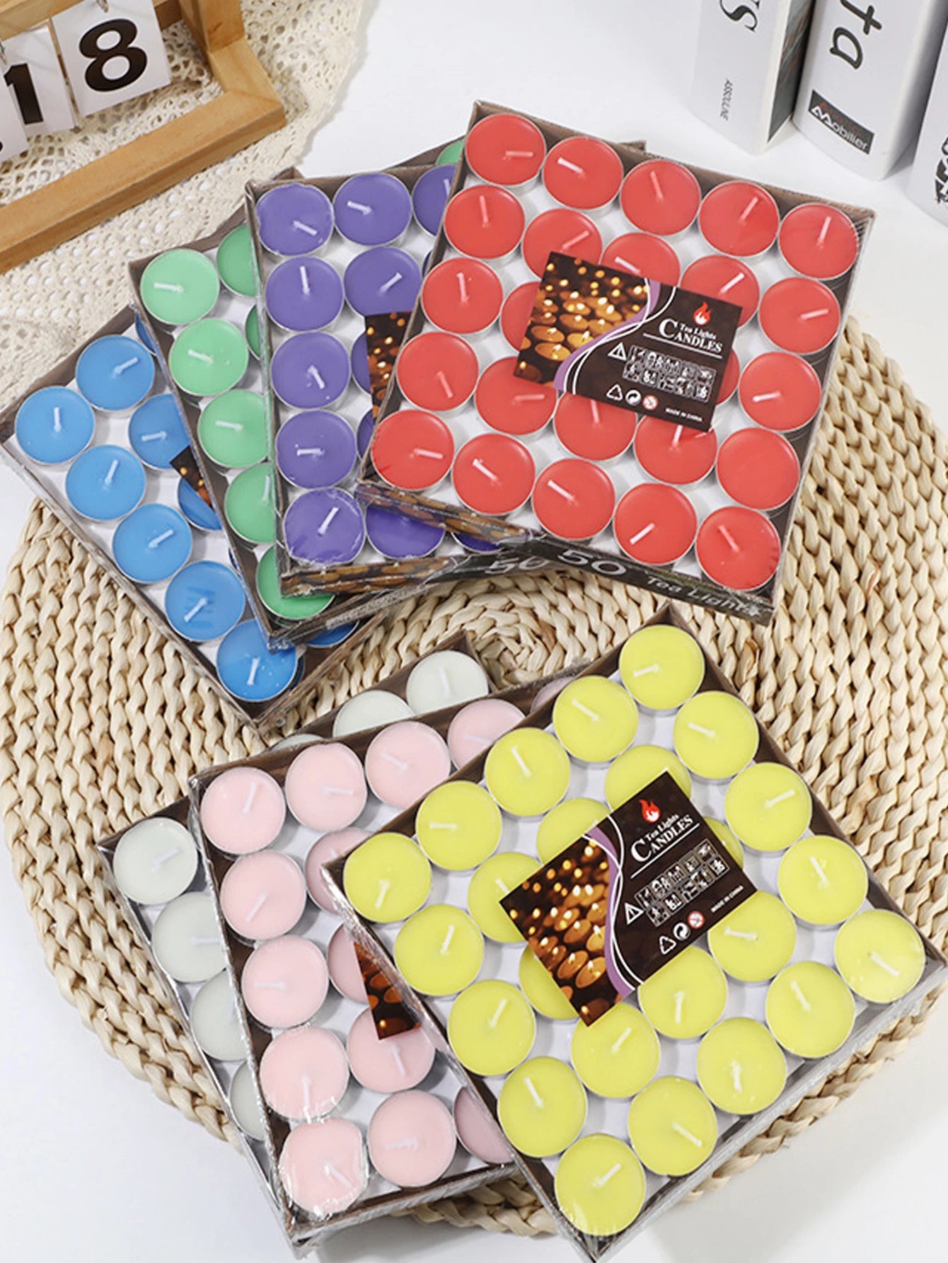 Color assortment tea lights in a box: blue, purple, red, green, yellow, pink, white
