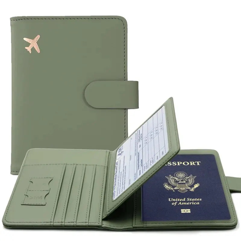 Forest green passport cover with hasp clasp, airplane emblem, and inner card slots