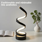 Spiral LED bedside lamp with black base and zigzag glowing light on tabletop
