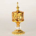 Gold lattice incense holder with floral cutouts and crystal base knob