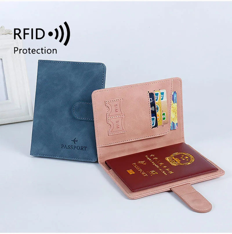 RFID passport holder set with blue and blush covers, featuring card slots on open flap