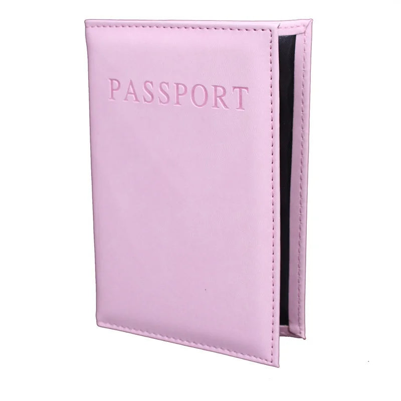 Light pink passport sleeve with embossed “PASSPORT” and black inner panel