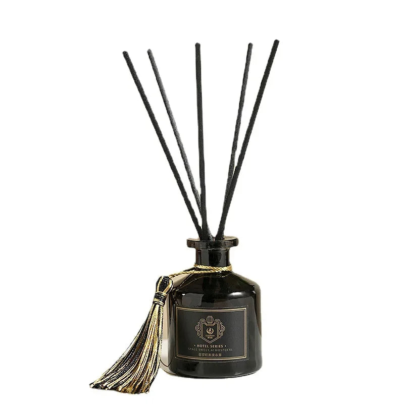 Reed diffuser set 50ml: dark glass bottle with black reeds and gold tassel
