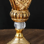 Brushed gold mabkhara close-up: perforated lantern body and engraved lower section