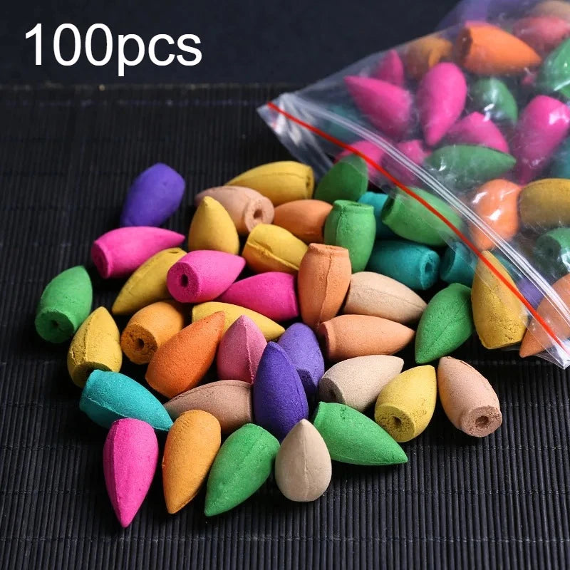 Mixed-color backflow incense cones with a clear bag, including orange, yellow, and white