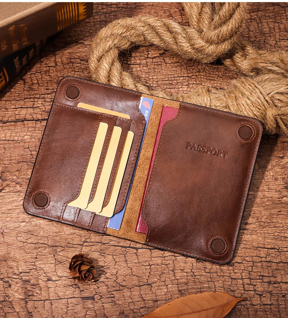 Warm espresso leather passport wallet open, card slots with pockets and embossed “PASSPORT” panel