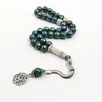 Tasbih misbaha with green-blue 10mm beads, silver rectangular centerpiece, and chain tassel