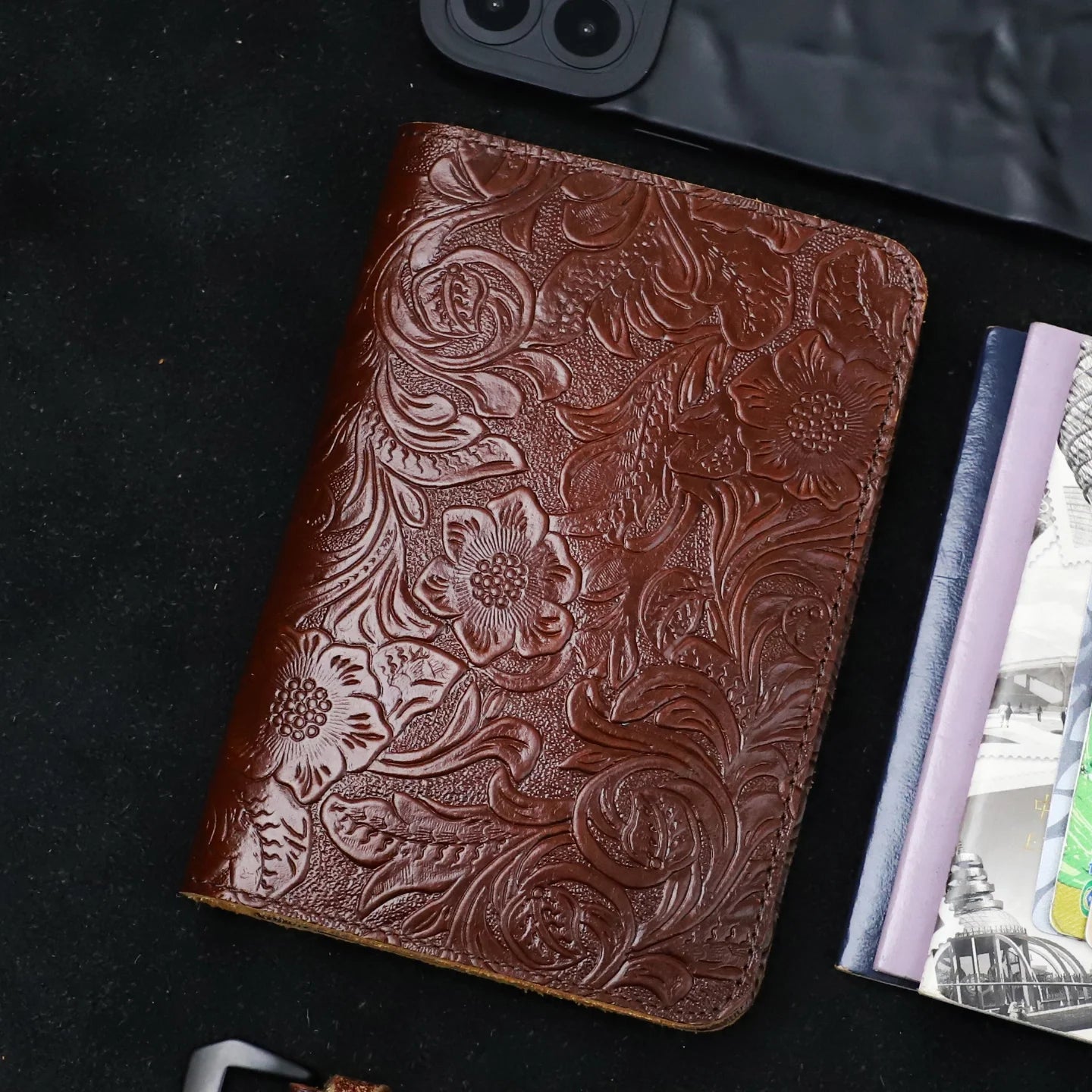 Cognac brown embossed leather travel folio with floral motifs and textured finish