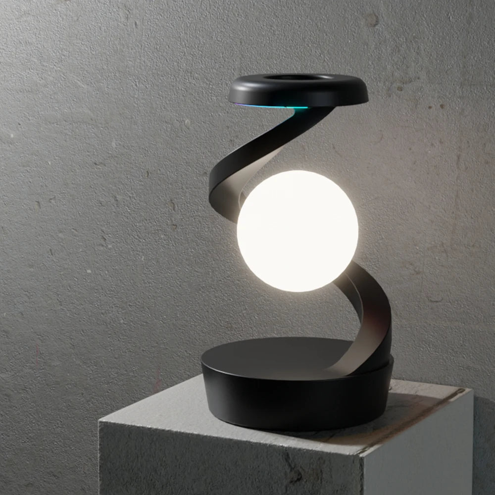 Obsidian floating wireless charging lamp with white glowing orb on dark base