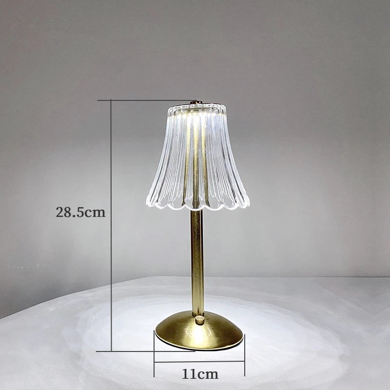 Cordless table lamp dimensions: 28.5cm tall, 11cm base; ribbed glass shade, gold base