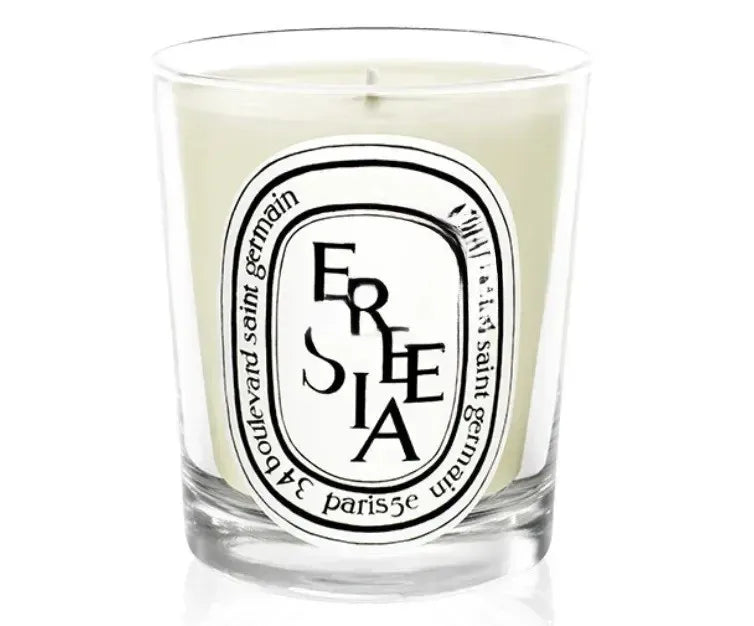 190g scented botanical candle in glass jar with FREESIA label and pale wax