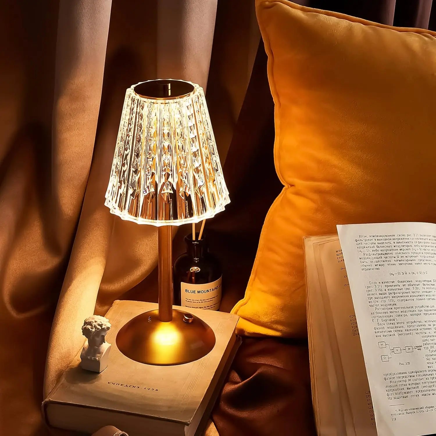 Champagne gold crystal table lamp with lit patterned shade and round gold base