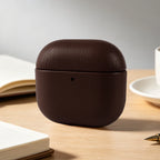 Dark Brown eco leather AirPods case, closed with pebble-grain texture