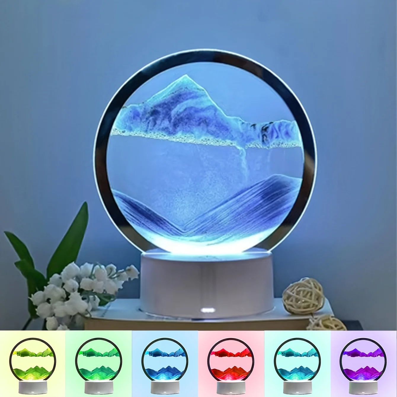Cordless reading lamp with glowing circular top in blue tones on a white base