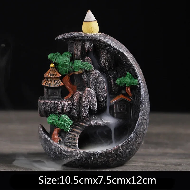 Waterfall incense burner, arched dark stone with green trees, orange bridge and smoke