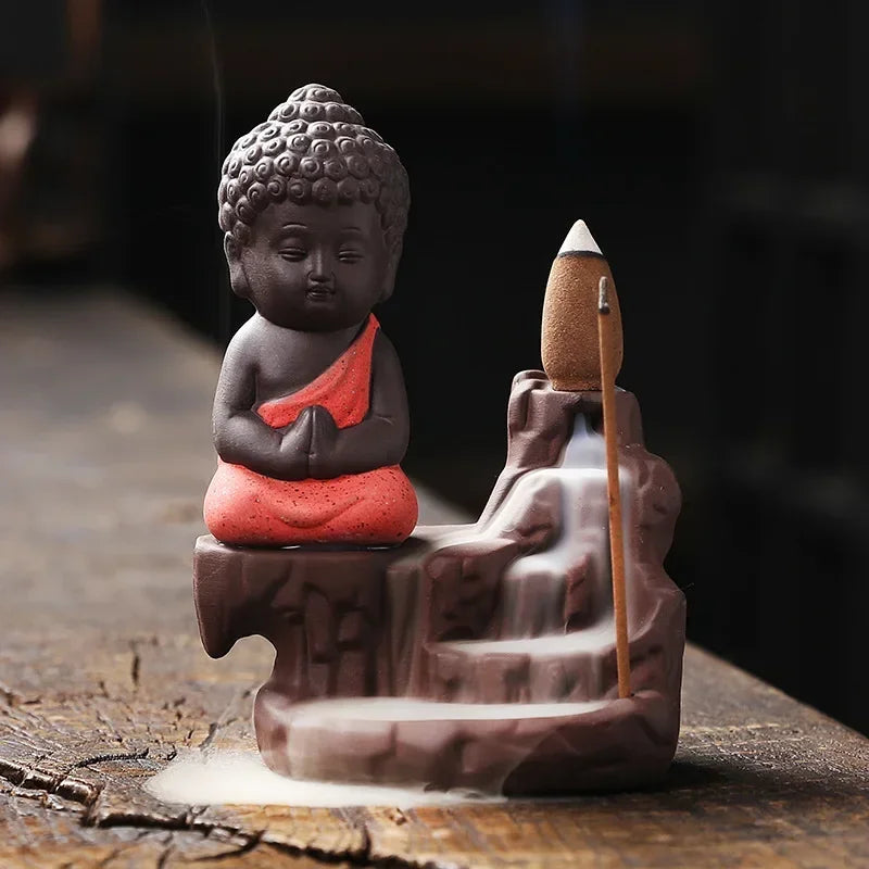 Backflow incense burner, red-robed Buddha with incense cone and cascading smoke