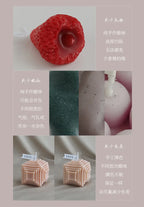 Red peony sculptural scented candle, textured flower shape on a white surface