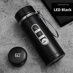 Black LED thermos flask with wrist strap and digital display reading 68°C