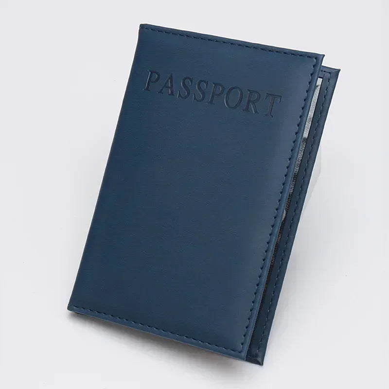 Dark blue classic travel passport sleeve with “PASSPORT” lettering