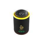 Dark electric bakhoor burner with glowing yellow rim, top vent mesh, and controls