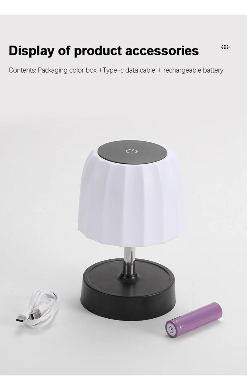 Cordless LED lamp with white shade and black base; includes USB cable and purple battery