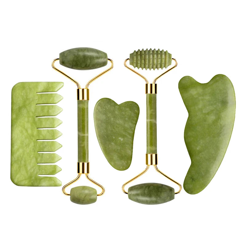 Nephrite jade tools set: two ribbed rollers, heart-shaped scraper, and oval massage stones