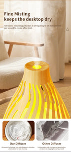 Wood grain aroma diffuser top with green LED light and mist spraying from vent.