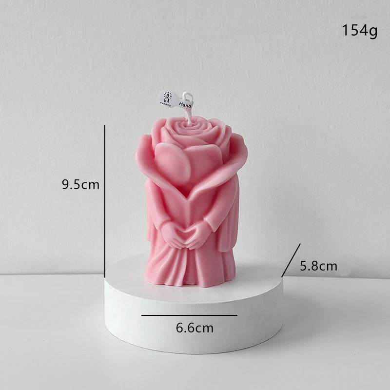 Pink rose-shaped candle figure on a round base, size 9.5 cm, 154 g