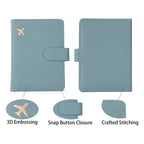 Light blue passport cover detail view: flap closure, airplane emblem, and stitched border