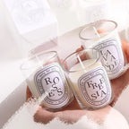 Three glass jar candles with flames; “ROSES” and “FRESTA” labels