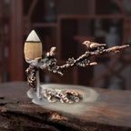 Metal incense stand: plum-branch motifs with leaf bowl and burning cone incense