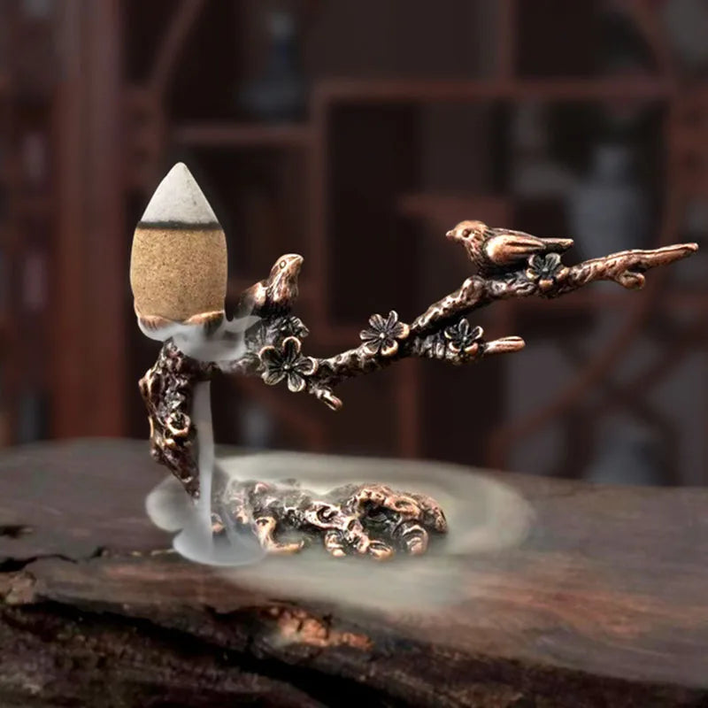 Metal incense stand: plum-branch motifs with leaf bowl and burning cone incense