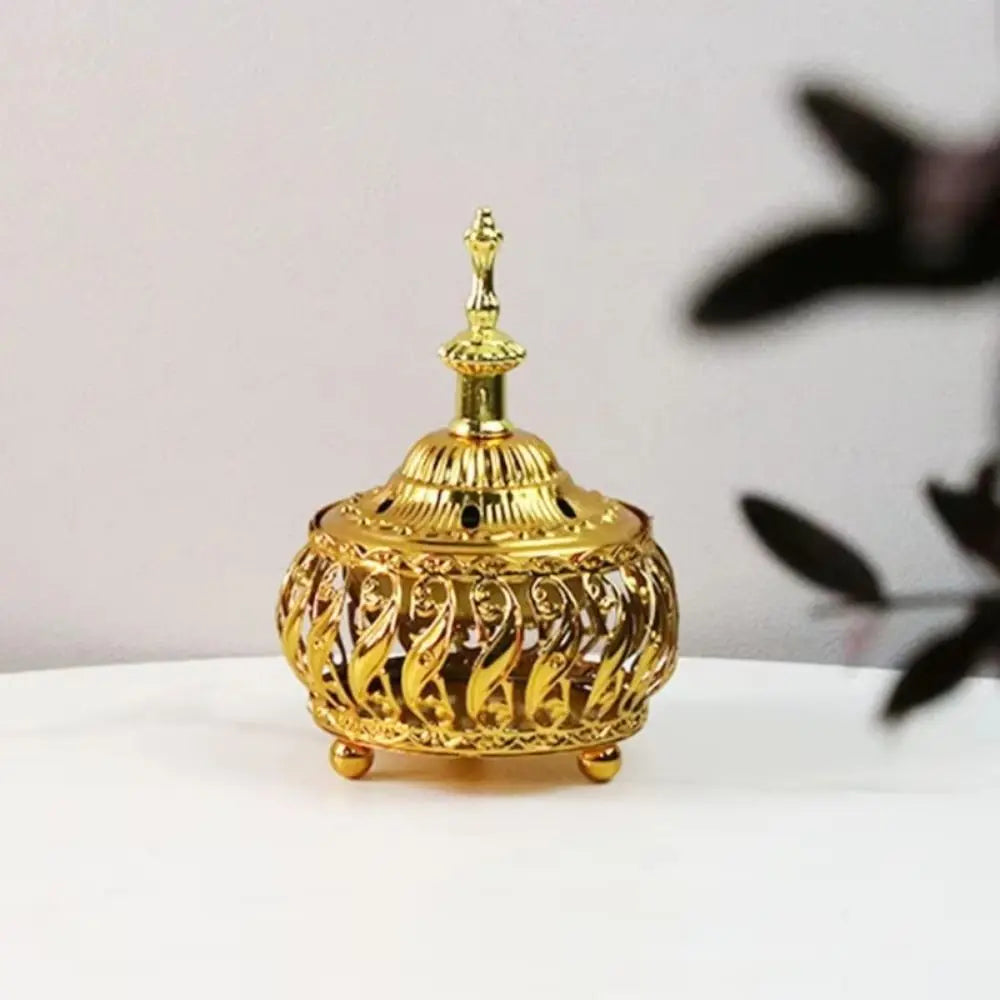 Gold ornamental dome incense burner with finial lid and small feet