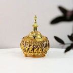 Gold ornamental dome incense burner with finial lid and small feet