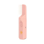 Pink electric hair bakhoor diffuser with comb-style heat plates, angled front view