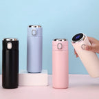 Compact smart thermos, 400ml with digital temperature display, hand holding pink