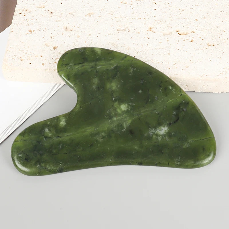 Heart-shaped jade gua sha massager, green Xiuyan jade with smooth polished surface