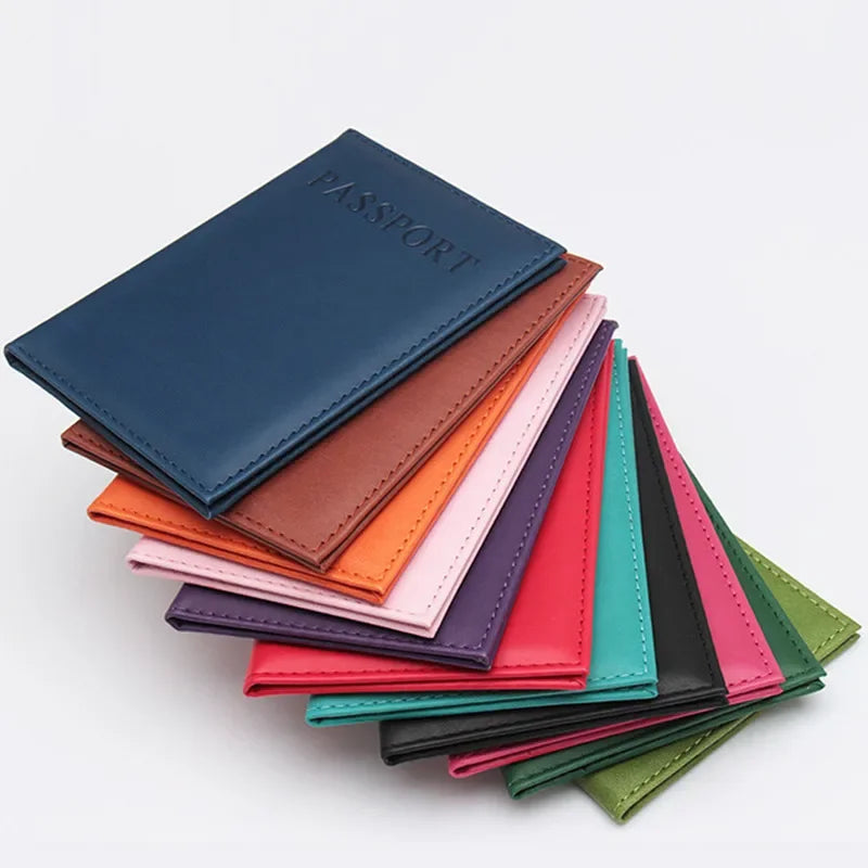 Blue passport sleeve stacked over other colors, embossed “PASSPORT” on the front