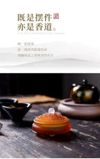 红棕色与琥珀色玻璃香器，顶部白色香头冒烟