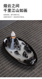 Tower backflow incense burner tray with flowing white smoke and black rim