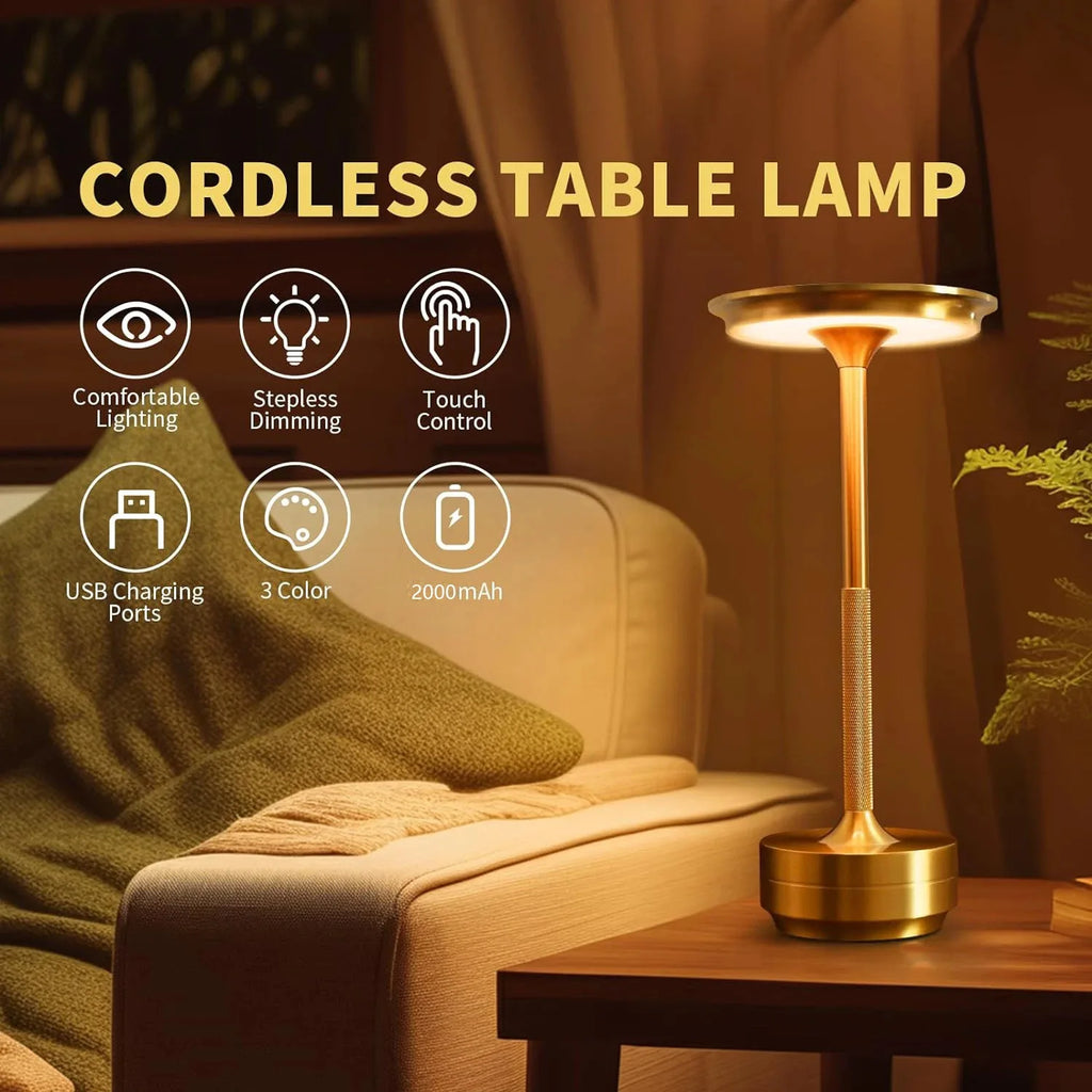 Cordless touch table lamp with tall golden stem and round base on nightstand