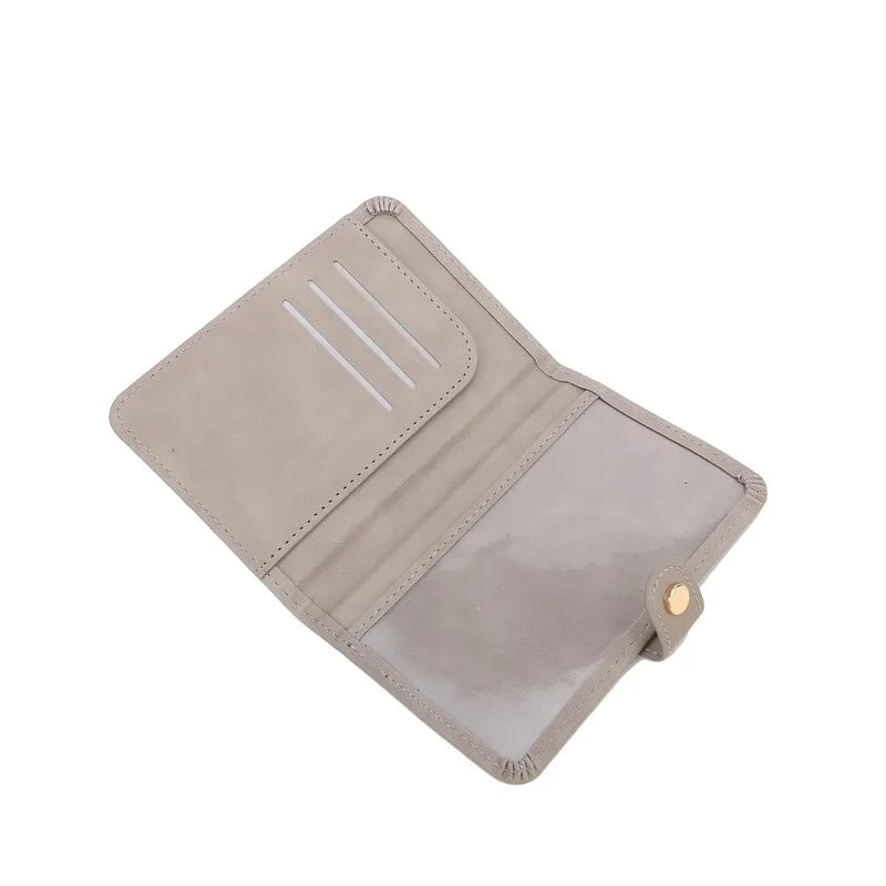 Slate gray passport wallet open view with card slots and side snap button