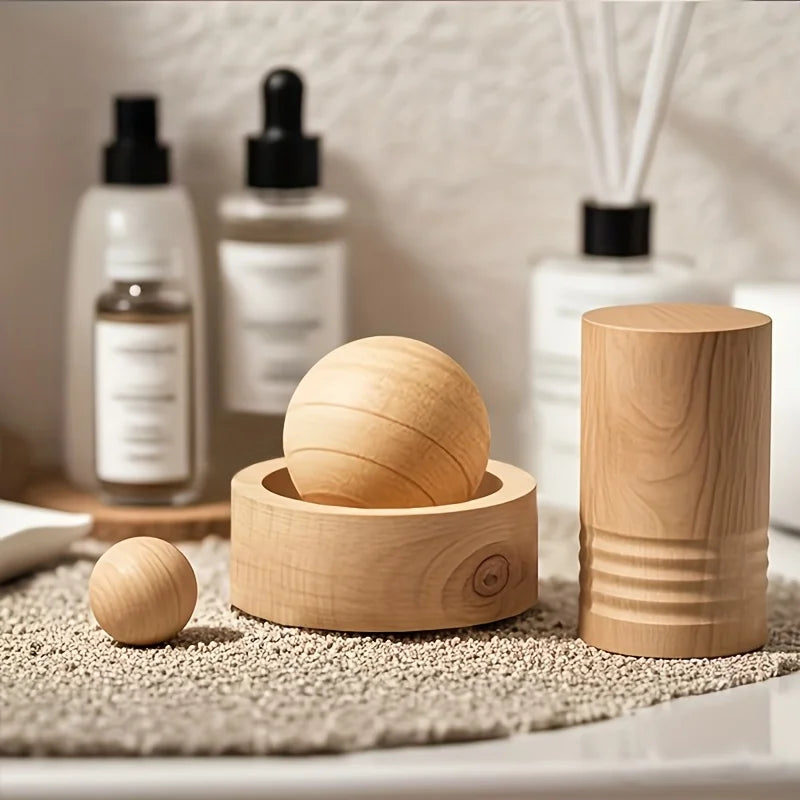 Natural wood mini aroma diffuser with round scent ball sitting in circular base