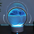 Cordless reading lamp in blue glow; ring-shaped light and sand steps effect