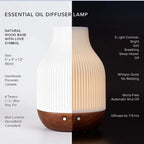 White ceramic aroma diffuser with wood base and illuminated light, front control dots