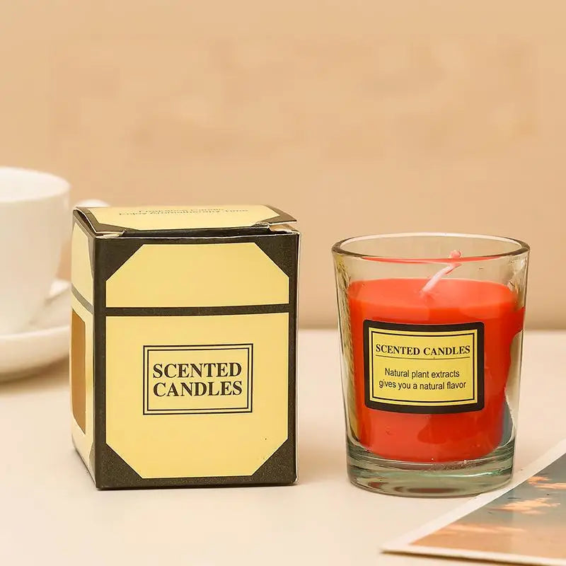 Aromatherapy candle in clear glass jar with red wax; gift box included